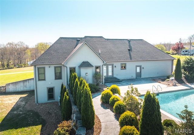 1100 Landon Rd, Bourbon, MO 65441 - back of house with an outdoor pool and a lawn
