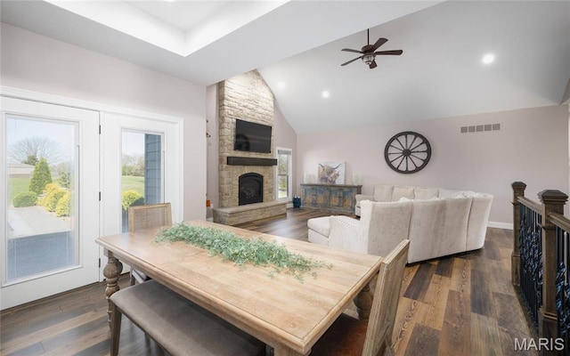 1100 Landon Rd, Bourbon, MO 65441 - dining room with a ceiling fan, a fireplace, recessed lighting, dark wood-type flooring, and high vaulted ceiling