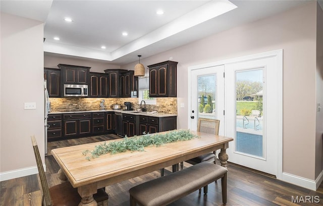 1100 Landon Rd, Bourbon, MO 65441 - kitchen featuring stainless steel appliances, a sink, backsplash, dark brown cabinets, and recessed lighting