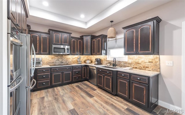 1100 Landon Rd, Bourbon, MO 65441 - kitchen featuring a sink, stainless steel appliances, dark brown cabinets, backsplash, and recessed lighting
