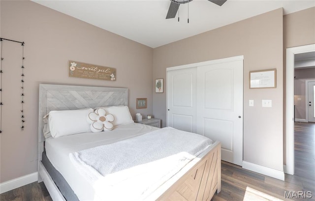 1100 Landon Rd, Bourbon, MO 65441 - bedroom featuring baseboards, a closet, dark wood-type flooring, and ceiling fan