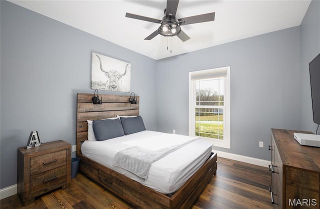 1100 Landon Rd, Bourbon, MO 65441 - bedroom with baseboards, dark wood finished floors, and ceiling fan