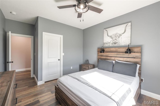 1100 Landon Rd, Bourbon, MO 65441 - bedroom with baseboards, wood finished floors, and ceiling fan