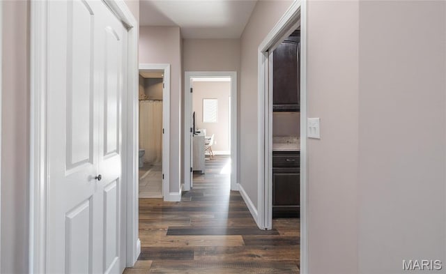 1100 Landon Rd, Bourbon, MO 65441 - hallway featuring dark wood-style flooring and baseboards