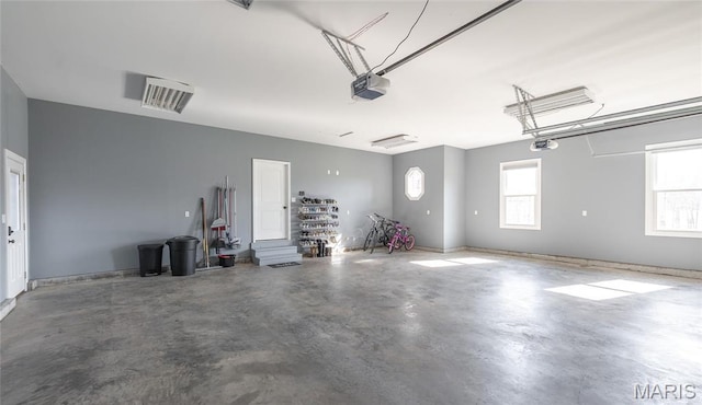 1100 Landon Rd, Bourbon, MO 65441 - garage featuring a garage door opener