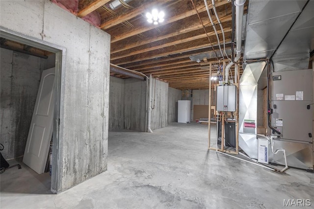1100 Landon Rd, Bourbon, MO 65441 - unfinished below grade area with heating unit, water heater, and tankless water heater