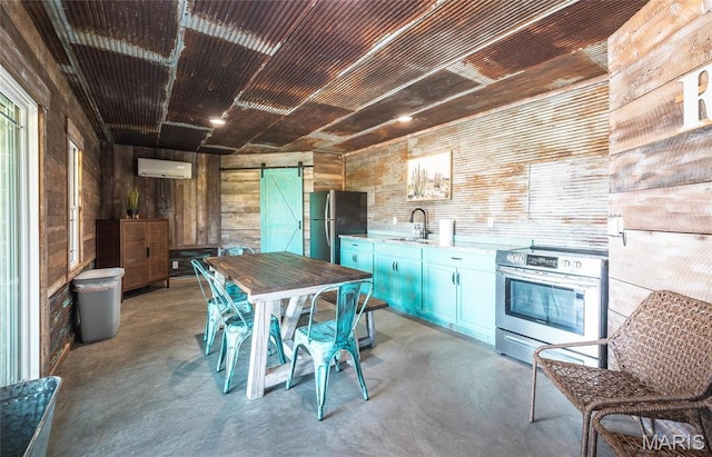 1100 Landon Rd, Bourbon, MO 65441 - kitchen with stainless steel appliances, a barn door, concrete floors, an AC wall unit, and wood walls
