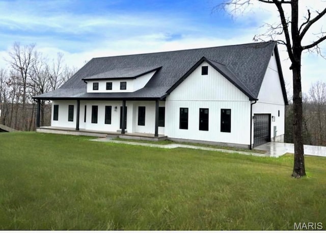 10102 Springer Dr, Bonne Terre, MO 63628 - modern inspired farmhouse with a garage, a porch, a front lawn, and roof with shingles
