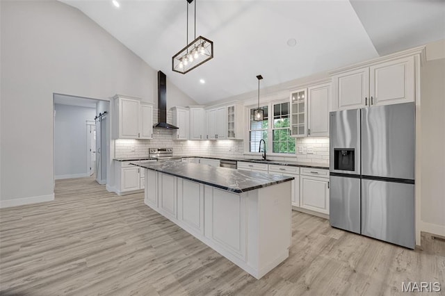 10102 Springer Dr, Bonne Terre, MO 63628 - kitchen with stainless steel appliances, wall chimney range hood, a sink, white cabinetry, and glass insert cabinets
