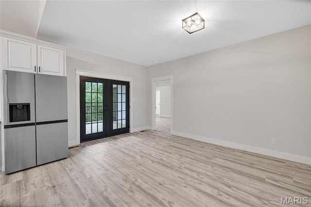 10102 Springer Dr, Bonne Terre, MO 63628 - unfurnished dining area with light wood-type flooring, baseboards, and french doors
