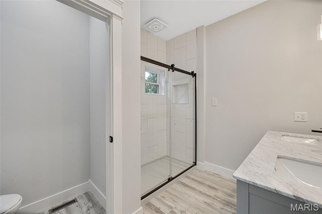 10102 Springer Dr, Bonne Terre, MO 63628 - full bath featuring wood finished floors, a shower stall, toilet, and baseboards
