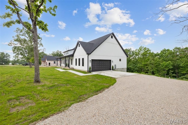 10102 Springer Dr, Bonne Terre, MO 63628 - view of side of property with driveway, a garage, and a yard