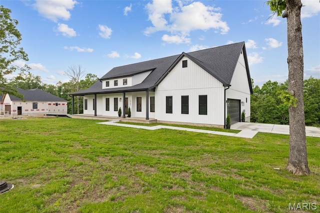 10102 Springer Dr, Bonne Terre, MO 63628 - modern farmhouse with a garage, driveway, a front yard, and a shingled roof