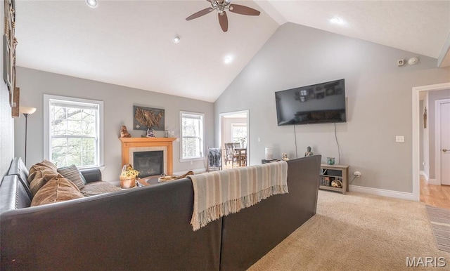21438 Lancaster Ln, Waynesville, MO 65583 - living room featuring ceiling fan, high vaulted ceiling, a fireplace, baseboards, and recessed lighting