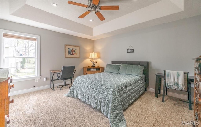 21438 Lancaster Ln, Waynesville, MO 65583 - carpeted bedroom with baseboards, a tray ceiling, recessed lighting, and ceiling fan