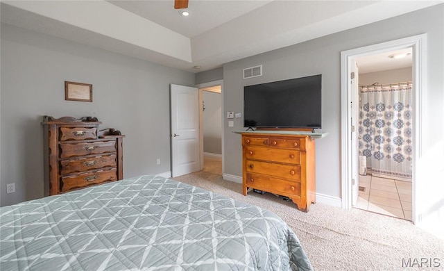 21438 Lancaster Ln, Waynesville, MO 65583 - bedroom with light carpet, baseboards, and connected bathroom