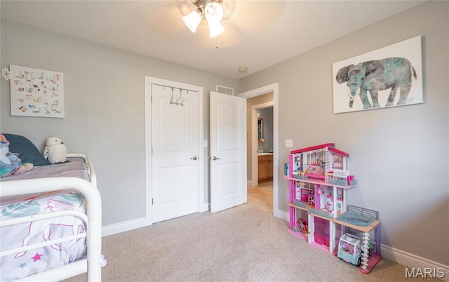 21438 Lancaster Ln, Waynesville, MO 65583 - carpeted bedroom with baseboards and a ceiling fan