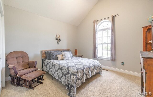 21438 Lancaster Ln, Waynesville, MO 65583 - bedroom featuring multiple windows, light carpet, lofted ceiling, and baseboards
