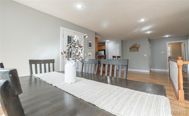 21438 Lancaster Ln, Waynesville, MO 65583 - dining space featuring light wood-style flooring, recessed lighting, and baseboards