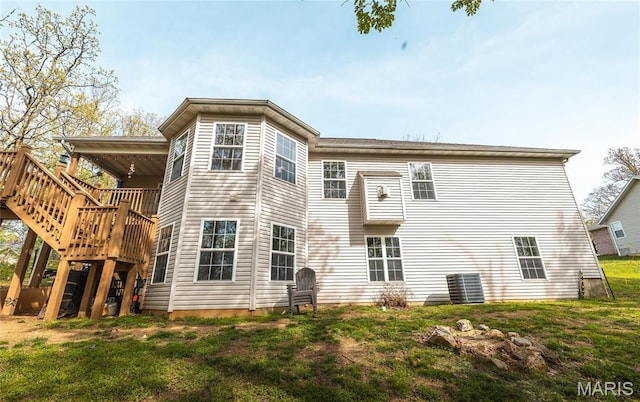 21438 Lancaster Ln, Waynesville, MO 65583 - rear view of house with a wooden deck, a lawn, and cooling unit