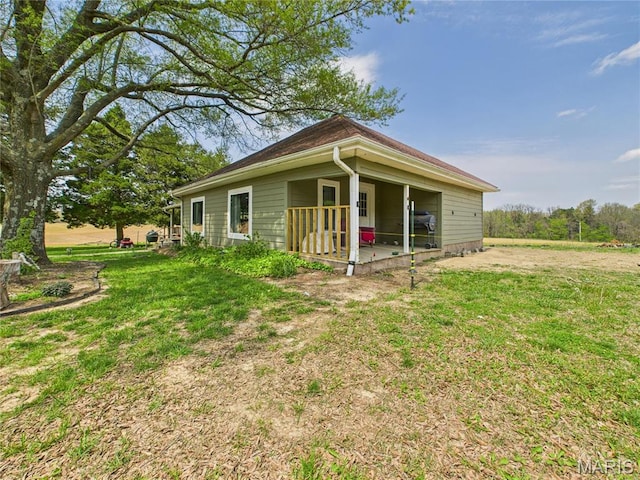 4627 County Road 651, Bernie, MO 63822 - rear view of property featuring a lawn