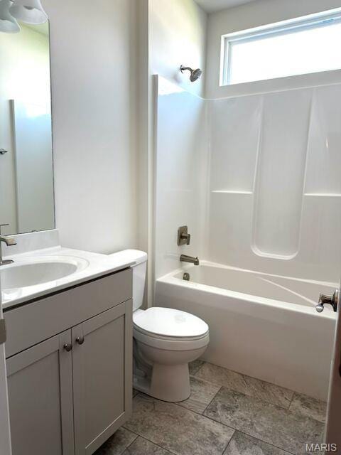 full bathroom featuring toilet, shower / washtub combination, and vanity