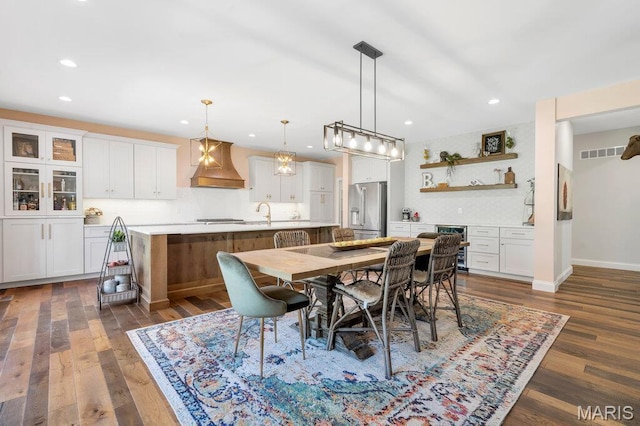 2509 Prairie Hollow Rd, Imperial, MO 63052 - dining area with recessed lighting, dark wood-style flooring, baseboards, and wine cooler
