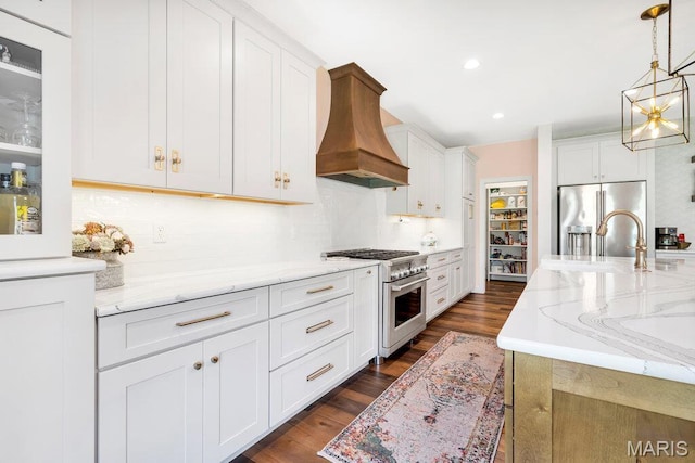 2509 Prairie Hollow Rd, Imperial, MO 63052 - kitchen with stainless steel appliances, custom exhaust hood, a sink, dark wood-style flooring, and decorative backsplash