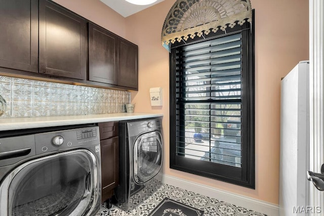 2509 Prairie Hollow Rd, Imperial, MO 63052 - laundry room featuring cabinet space, washing machine and dryer, and baseboards