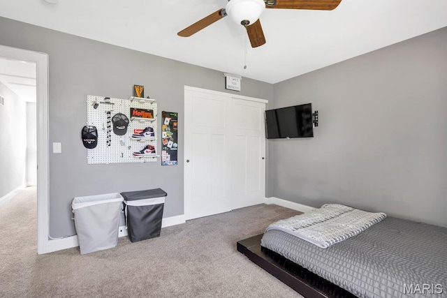 2509 Prairie Hollow Rd, Imperial, MO 63052 - carpeted bedroom with baseboards, a closet, and a ceiling fan