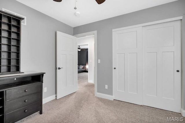 2509 Prairie Hollow Rd, Imperial, MO 63052 - unfurnished bedroom with carpet flooring, baseboards, a closet, and ceiling fan