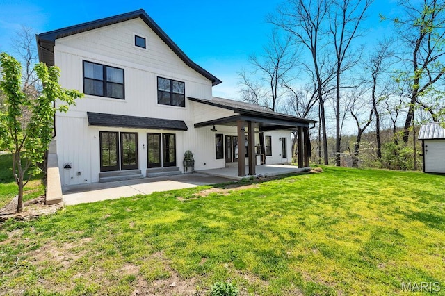 2509 Prairie Hollow Rd, Imperial, MO 63052 - rear view of house with a patio, ceiling fan, and a yard