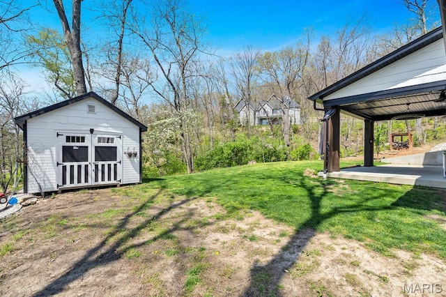 2509 Prairie Hollow Rd, Imperial, MO 63052 - view of grassy yard with an outdoor structure and a patio area