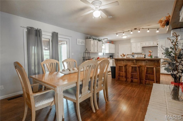 121 Ripley 142e-18, Doniphan, MO 63935 - dining area with a ceiling fan, dark wood-style flooring, and baseboards