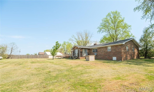 121 Ripley 142e-18, Doniphan, MO 63935 - back of property featuring a chimney, brick siding, and a wooden deck