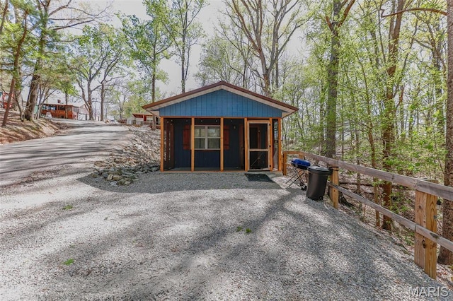 view of outdoor structure featuring a sunroom