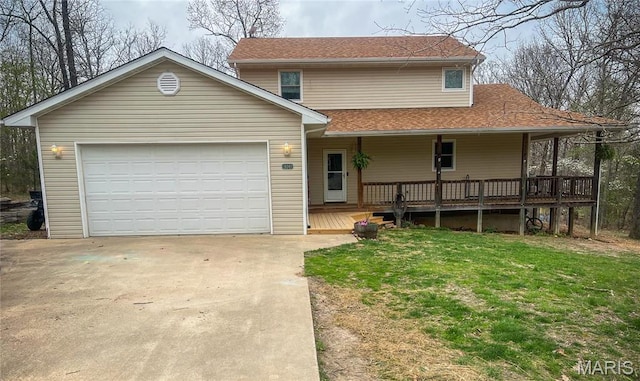 view of front of property featuring concrete driveway, a front yard, a shingled roof, covered porch, and an attached garage