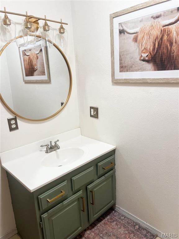 bathroom featuring vanity and baseboards