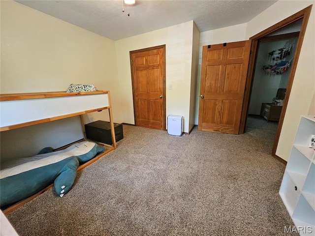 unfurnished bedroom with carpet floors