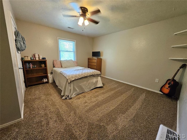 bedroom with carpet flooring, a textured ceiling, baseboards, and ceiling fan