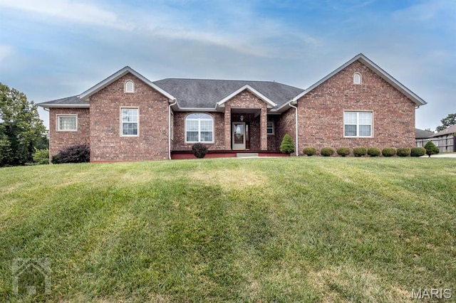 220 April Dr, Saint Robert, MO 65584 - ranch-style house featuring brick siding, a front yard, and roof with shingles