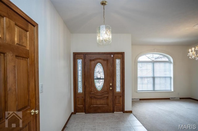 220 April Dr, Saint Robert, MO 65584 - foyer with a chandelier, baseboards, and light tile patterned flooring