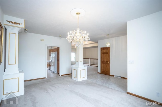 220 April Dr, Saint Robert, MO 65584 - unfurnished dining area with baseboards, light colored carpet, and a chandelier
