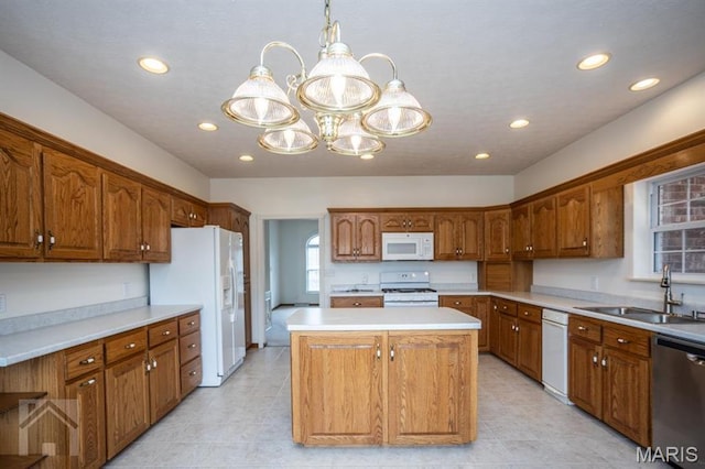 220 April Dr, Saint Robert, MO 65584 - kitchen with white appliances, a sink, a chandelier, a kitchen island, and recessed lighting