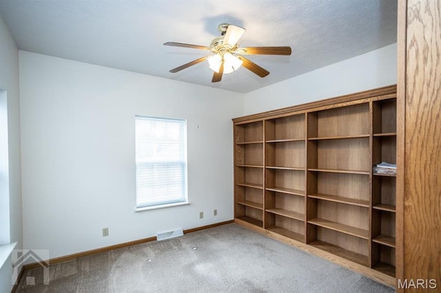 220 April Dr, Saint Robert, MO 65584 - carpeted empty room featuring baseboards and a ceiling fan
