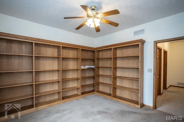 220 April Dr, Saint Robert, MO 65584 - carpeted empty room with a textured ceiling, a ceiling fan, and baseboards