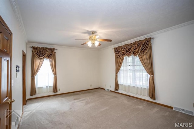220 April Dr, Saint Robert, MO 65584 - carpeted empty room with a ceiling fan, crown molding, and baseboards