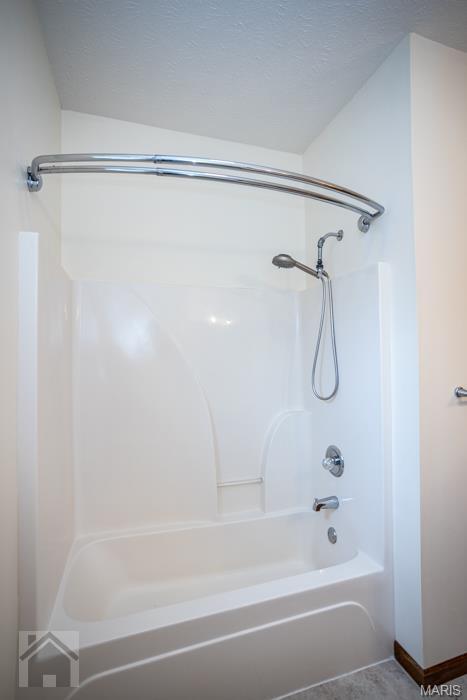 220 April Dr, Saint Robert, MO 65584 - bathroom featuring shower / tub combination