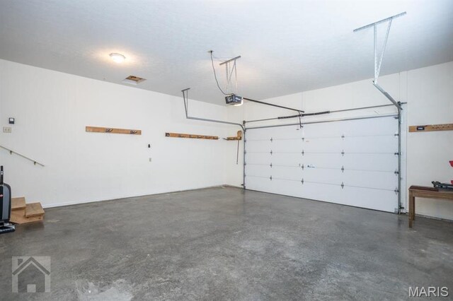 220 April Dr, Saint Robert, MO 65584 - garage with a garage door opener