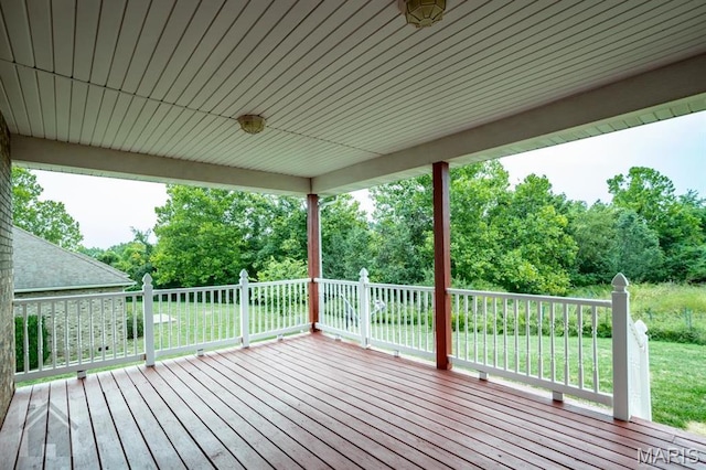 220 April Dr, Saint Robert, MO 65584 - wooden terrace featuring a yard and view of scattered trees